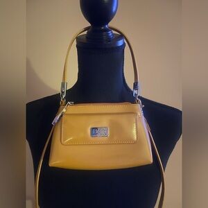Gently pre-owned yellow Beijo patent leather mini Crossbody Bag. With 2 straps.